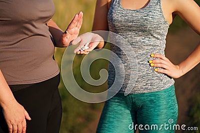 Overweight woman refuse to take slimming pills Stock Photo