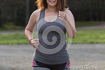Overweight woman running. Weight loss concept. Stock Photo