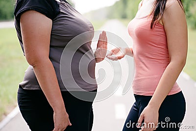 Overweight woman refuse to take slimming pills Stock Photo