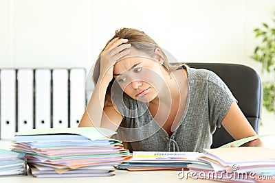 Overworked employee tired at office Stock Photo