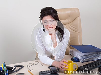 Overworked woman with pain in office Stock Photo