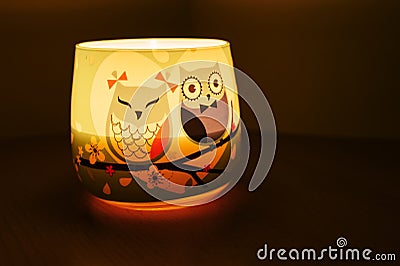 Owl candle shining Stock Photo