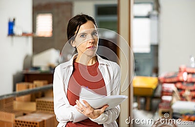 Owner of the apartment checks the completed repair work according to plan Stock Photo