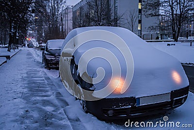 The owner of the car in the winter forgot to turn off the lights Stock Photo