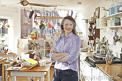 Owner Of Homeware Shop Standing In Store Stock Photo