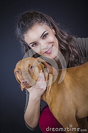 Owner petting a young hungarian vizsla Stock Photo