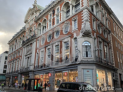 Oxford street with Uniqlo store a Japanese casual wear designer, manufacturer and retailer Editorial Stock Photo