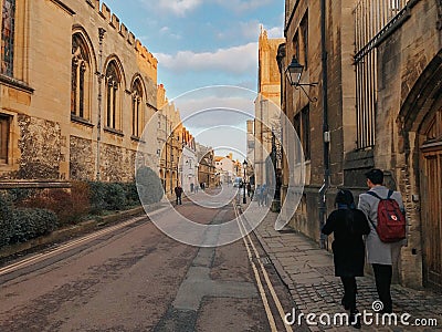 Oxford, United Kingdom: Photograph of couple strolling through the streets of Oxford Editorial Stock Photo
