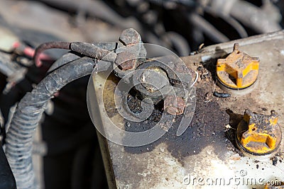 Oxidized and dirty car battery terminal. Battery terminals corrode dirty damaged problem. Old battery corrosion deteriorate leakin Stock Photo