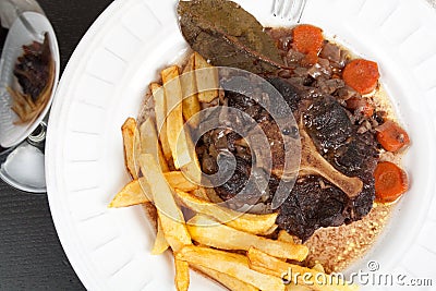 Oxtail stew with carrots and fries Stock Photo