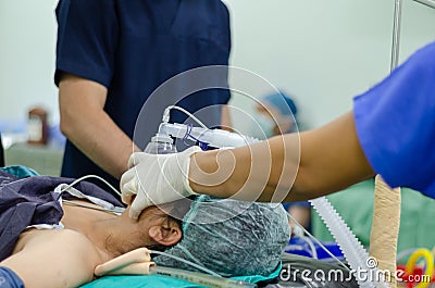 Oxygen inhalation to the patient Stock Photo