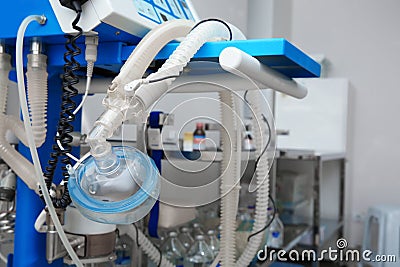 Oxygen mask as part of artificial lungs ventilation machine in surgery room, closeup. Stock Photo