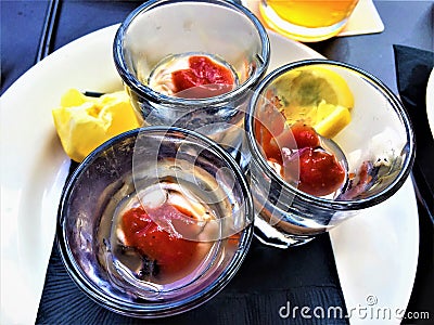 Oyster Shooters with Lemon and Cocktail Sauce Stock Photo