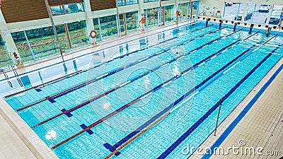 05.12.2022 Ozarow Mazowiecki, Poland - High angle shot of a swimming pool with a single person Editorial Stock Photo