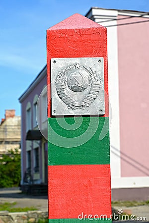 OZERSK, RUSSIA. Coat of arms of the Soviet Union on the border post. Fragment of the memorial sign `Border guards of all generati Editorial Stock Photo