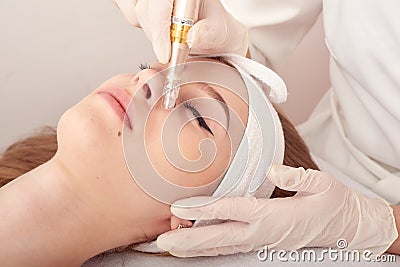 Ozone treatment with cosmetology apparat. Physiotheraphy. Lifting effect . Ozone face skin rejuvenation, regeneration of Stock Photo