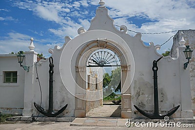 Giant anchors adorn the gate of a colonial building on Mozambique Island Editorial Stock Photo