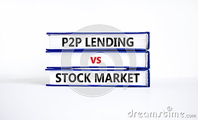 P2P, peer to peer lending vs stock market symbol. Concept words `P2P lending vs stock market` on books. Beautiful white backgrou Stock Photo