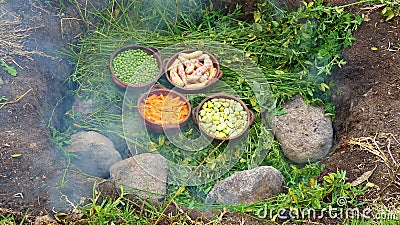 The pachamanca is an ancestral cooking process underground, ecuador Stock Photo