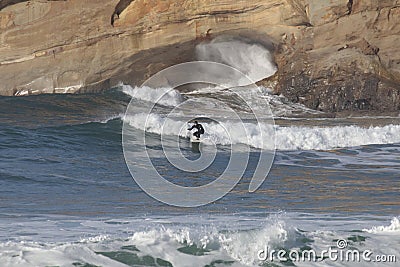 Surfers at Cape Kiwanda During the King Tide of February 2020 Editorial Stock Photo