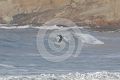 Surfers at Cape Kiwanda During the King Tide of February 2020 Editorial Stock Photo