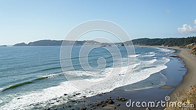 Pacific surf laps at the Oregon coastline. Stock Photo