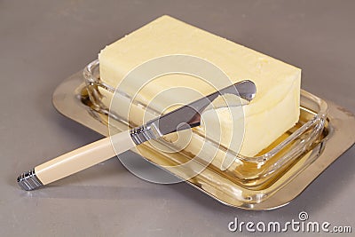 Pack of butter in a butter dish Stock Photo