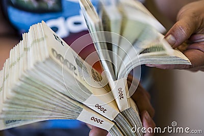 Pack of money - big pile of banknotes in hand Stock Photo