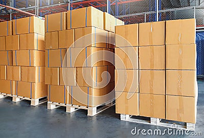 Package Boxes Stacked on Wooden Pallets in Warehouse. Cargo Supplies Warehouse Shipping. Shipment Boxes, Supply Chain. Stock Photo