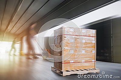 Package Boxes Wrapped Plastic Stacked on Pallets Loading into Cargo Container. Shipment. Freight Truck Logistics Cargo Transport Stock Photo