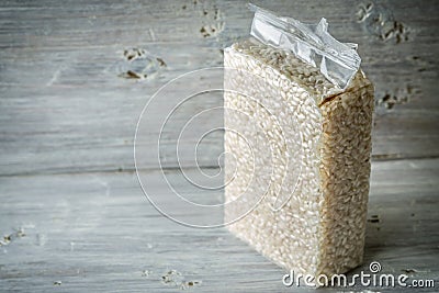 Packaging with Arborio rice on old blue boards Stock Photo