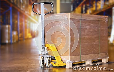 Packaging Boxes Wrapped Plastic on Pallet with Hand Pallet Truck. Distribution Storage Warehouse. Cargo Shipment. Supplies Stock Photo