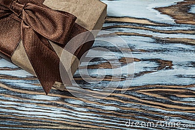 Packed brown present box on wooden background Stock Photo