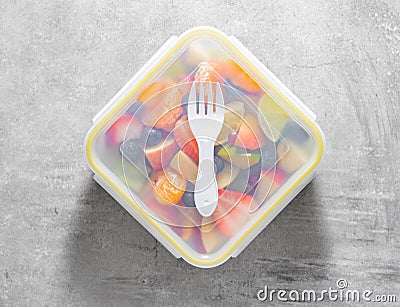 Packed fruit salad in plastic box. Healthy meal to go Stock Photo