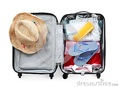 Packed suitcase with summer clothes on white background Stock Photo