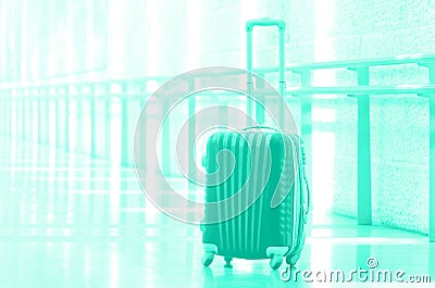 Packed travel suitcase, airport. Summer holiday and vacation concept. Trendy green and turquoise color. Traveler baggage, brown Stock Photo