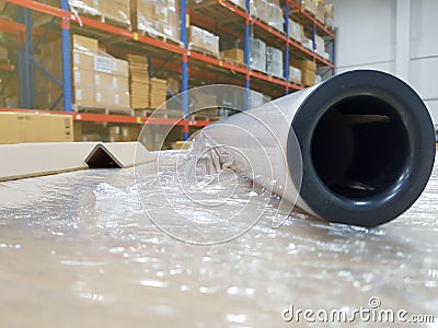 Packing accessories at workplace of industry,Stretch Wrap Industrial Strength,Roll of wrapping plastic stretch Stock Photo