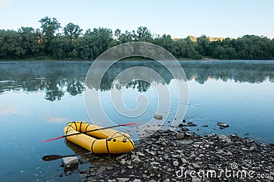 Packrafting concept with yellow packraft boat Stock Photo