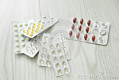 Packs of different pills lie on a white background. Stock Photo