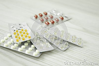 Packs of different pills lie on a white background. Stock Photo