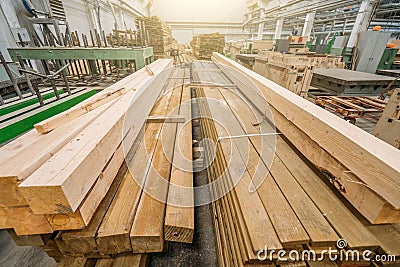 Packs of different wooden beams in woodworking workshop close up Stock Photo