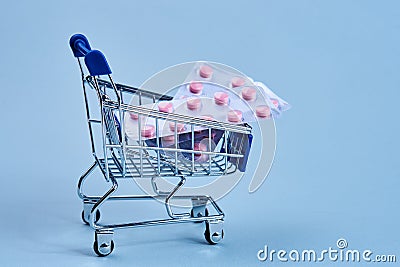 packs of pills in a trolley shopping in a pharmacy medicines Stock Photo