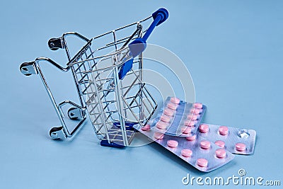 packs of pills in a trolley shopping in a pharmacy medicines Stock Photo