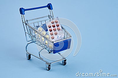 packs of pills in a trolley shopping in a pharmacy medicines Stock Photo