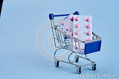 packs of pills in a trolley shopping in a pharmacy medicines Stock Photo