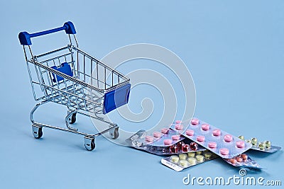 packs of pills in a trolley shopping in a pharmacy medicines Stock Photo