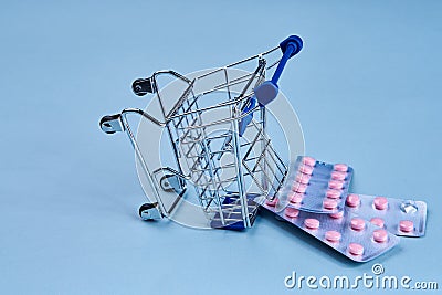 packs of pills in a trolley shopping in a pharmacy medicines Stock Photo