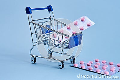 packs of pills in a trolley shopping in a pharmacy medicines Stock Photo