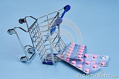 packs of pills in a trolley shopping in a pharmacy medicines Stock Photo