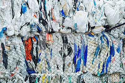 Packs and Stocks of Wrapped Scrap Plastic Dedicated for Eco Recycling in front of a Recycling Factory Editorial Stock Photo